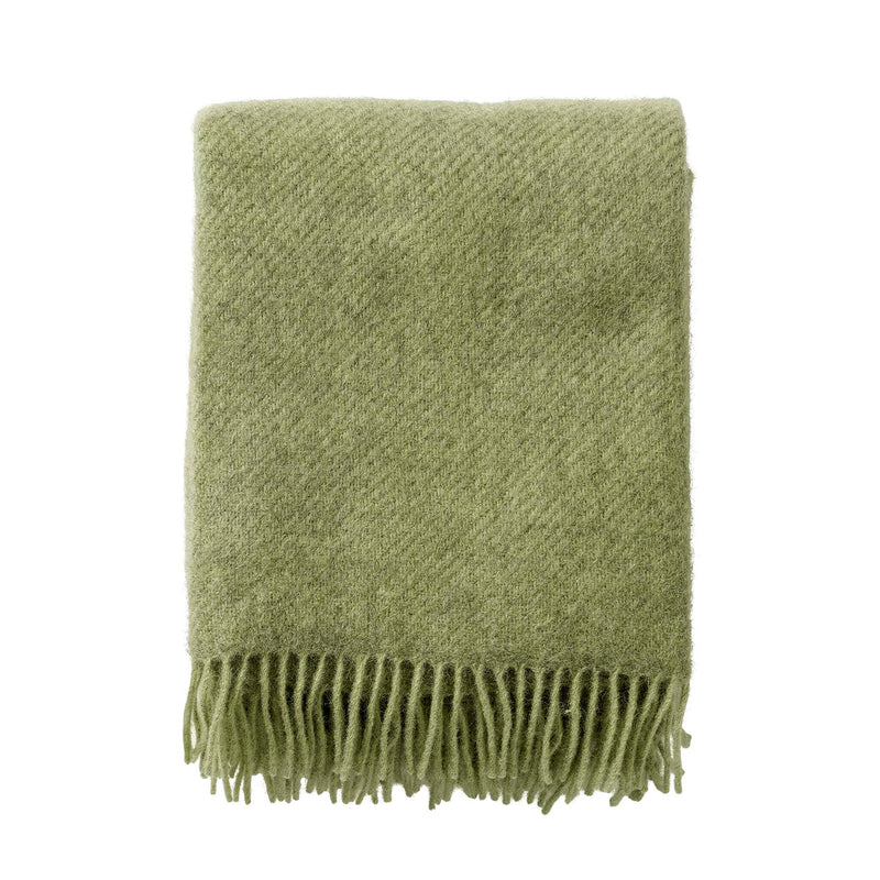 Klippan Gotland brushed wool throw in Pear, folded on a white background