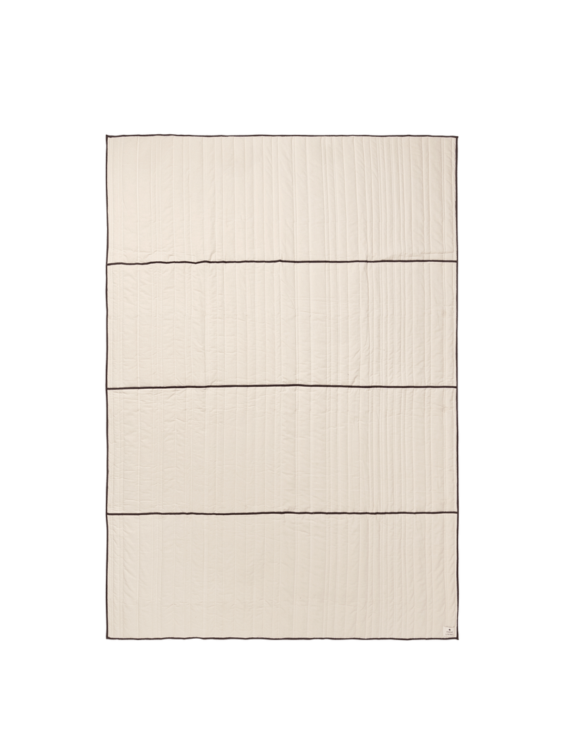 ferm LIVING Vari quilted bedspread in Natural with dark chocolate piping, shown flat on white