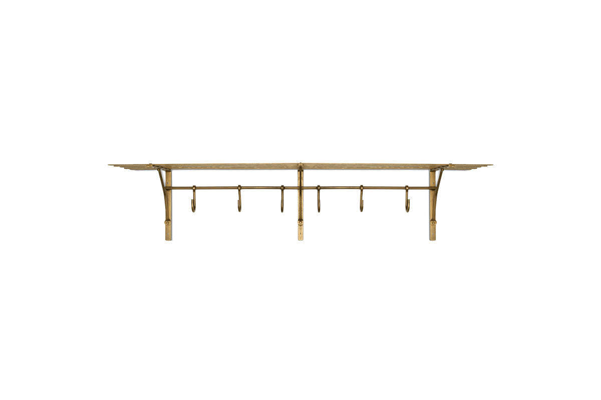 Nkuku Basti antique brass iron storage shelf with six hooks on a white background