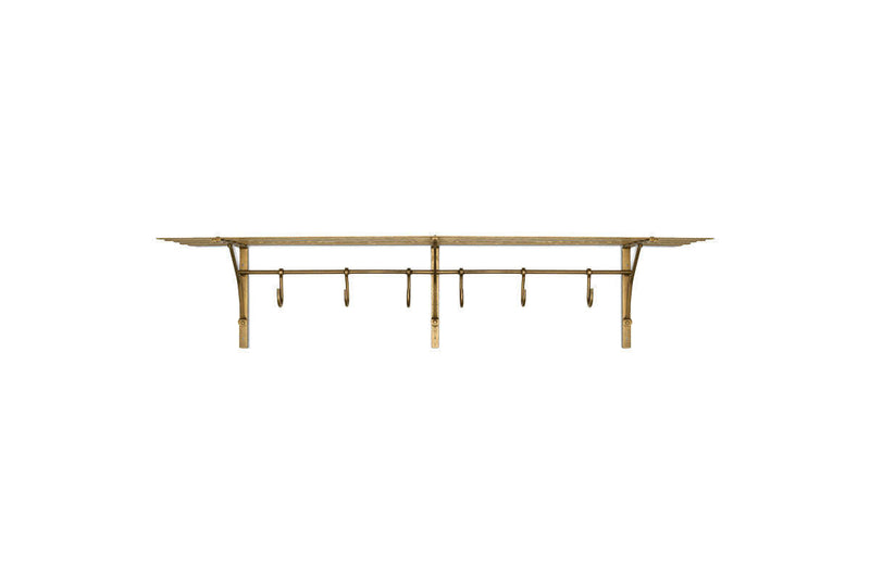 Nkuku Basti antique brass iron storage shelf with six hooks on a white background