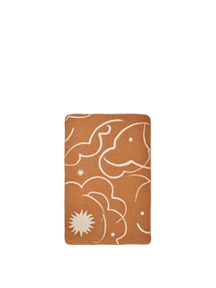 ferm LIVING Skye brushed cotton blanket, sienna side with parchment motifs, on white