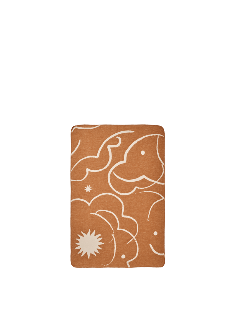 ferm LIVING Skye brushed cotton blanket, sienna side with parchment motifs, on white