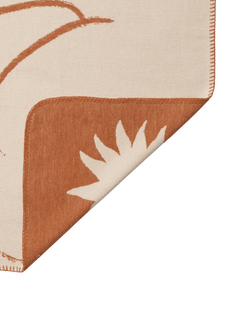 Folded corner of the Skye blanket showing both faces and the contrast stitched edge