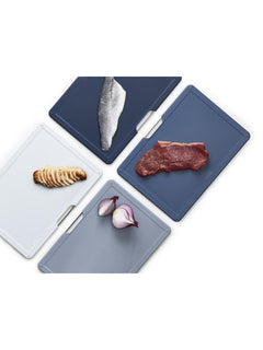 All four grey-to-navy Folio boards in use with fish, meat and vegetables