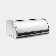 Matt steel Brabantia Roll Top bread bin shown at an angle with the lid part open