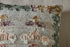 Corner detail of the Dantri cushion cover showing the handloom weave and floral border