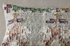 Close-up of the muted floral pattern woven into the Dantri cushion cover