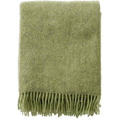 Pear green Gotland wool throw folded to show the fringed short side