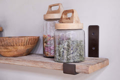 Close view of the antique brass bracket and reclaimed timber grain