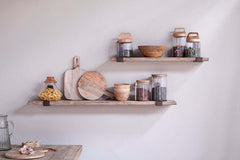 Two Ibo wall shelves styled with wooden bowls, boards and storage jars