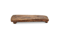 Side view of the Kaveeta reclaimed wood serving board on a white background
