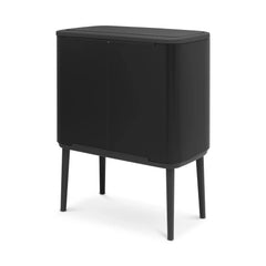 Matt black Bo Touch Bin seen from the rear three-quarter angle on tapered legs