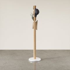 White and natural Umbra Flapper coat rack with a hat and scarf on its flip-down hooks